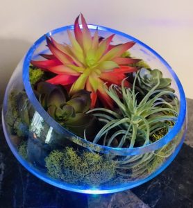 Glass vase with artificial succulents