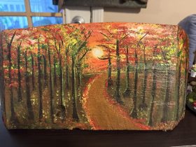 Acrylic painting on tree trunk